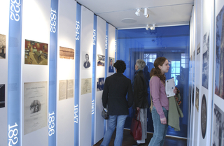 Visitors enjoying an exhibit inside the Yale Visitor Center.