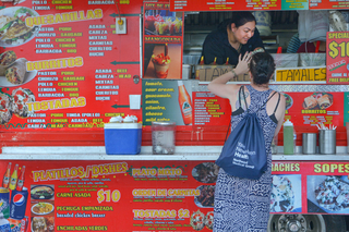 A customer being helped at one of New Haven's famous food trucks at Long Wharf.