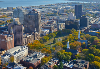 Aerial view of the New Haven on a sunny fall day with the Long Island Sound in the background.